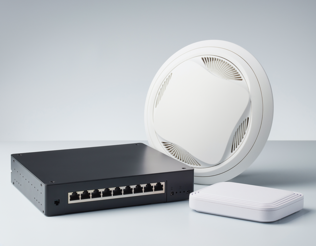Ubiquiti UniFi access point, switch and gateway displayed together