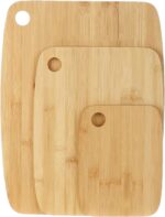 Bamboo cutting board used as a charcuterie board with cheese and fruit